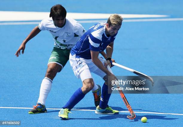 Muhammad Aleem Bilal of Pakistan and Lee Morton of Scotland battle for possession during the Pool B match between Scotland and Pakistan on day five...