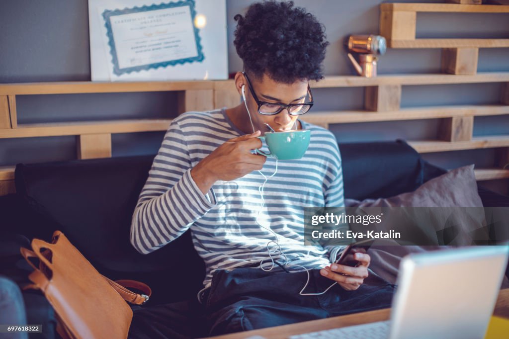 Young man working at home office