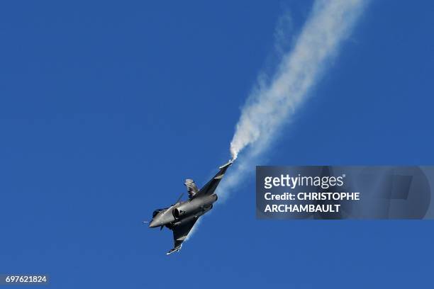 Dassault Aviation Rafale fighter jet performs during a flight display on June 19, 2017 at the International Paris Air Show in Le Bourget outside...