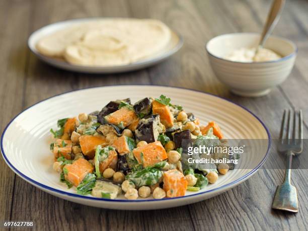 roasted sweet potato,aubergine with chickpeas - chick pea salad stock pictures, royalty-free photos & images