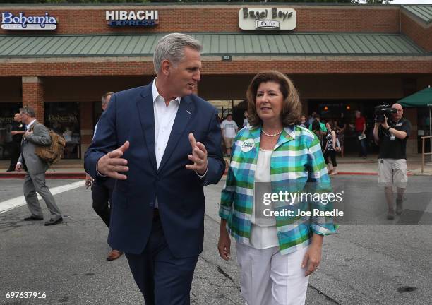 House Majority Leader Rep. Kevin McCarthy walks with Republican candidate Karen Handel during a campaign stop as she runs for Georgia's 6th...