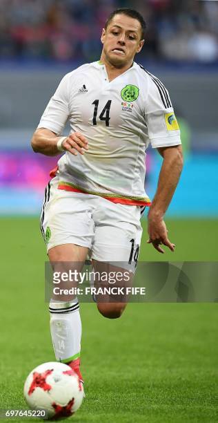 Mexican Javier Hernandez runs with a ball during the 2017 Confederations Cup group A football match between Portugal and Mexico at the Kazan Arena in...