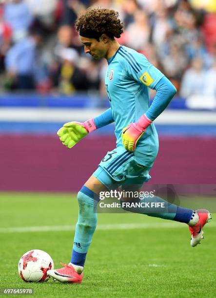 Mexican goalkeeper Guillermo Ochoa passes the ball during the 2017 Confederations Cup group A football match between Portugal and Mexico at the Kazan...