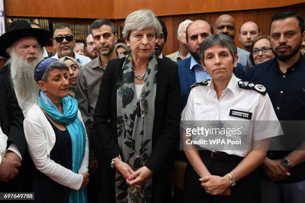 British Prime Minister Theresa May and Metropolitan Police Commissioner Cressida Dick talk to faith leaders at Finsbury Park Mosque on June 19, 2017...