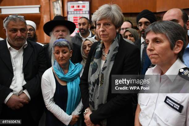 British Prime Minister Theresa May and Metropolitan Police Commissioner Cressida Dick talk to faith leaders at Finsbury Park Mosque on June 19, 2017...