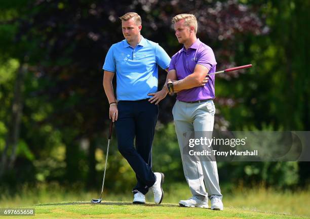 James Webber of Three Rivers Golf & Country Club and Thomas Wiskin of Playgolf Colchester wait to putt on the 18th green during the Golfbreaks.com...