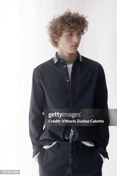 Model is seen backstage ahead of the N.21 show during Milan Men's Fashion Week Spring/Summer 2018on June 19, 2017 in Milan, Italy.