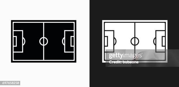 soccer field icon on black and white vector backgrounds - soccer field outline stock illustrations