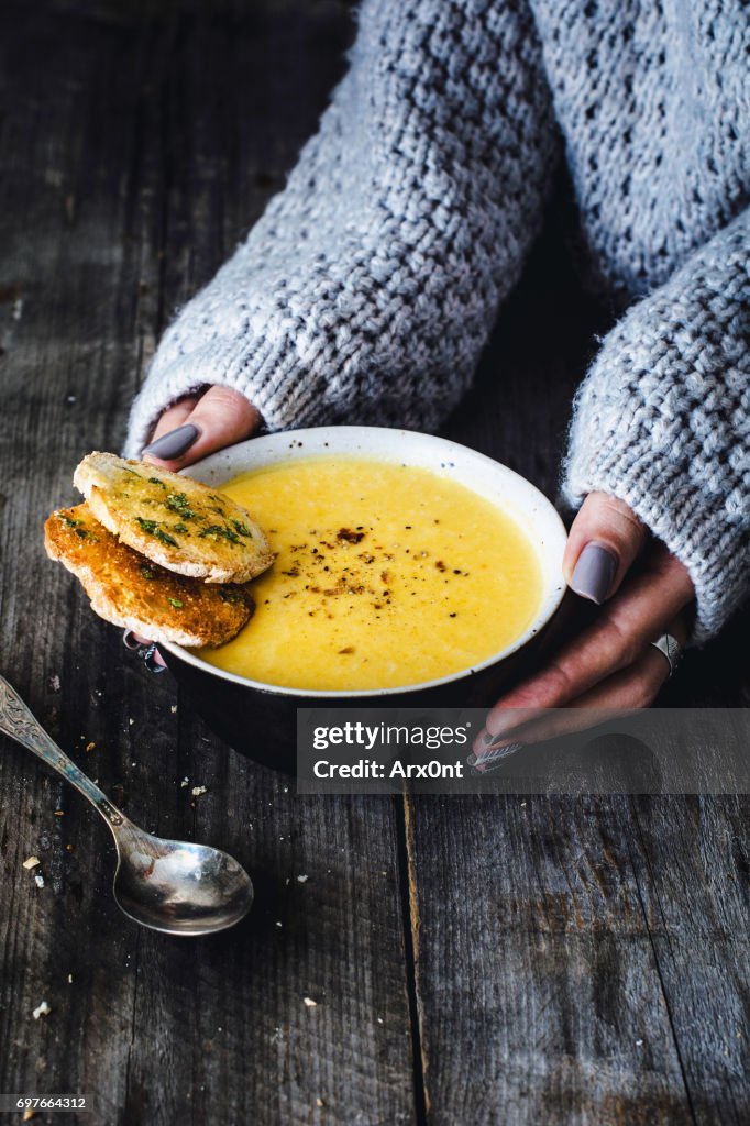 Carrot pumpkin cream soup with garlic bread