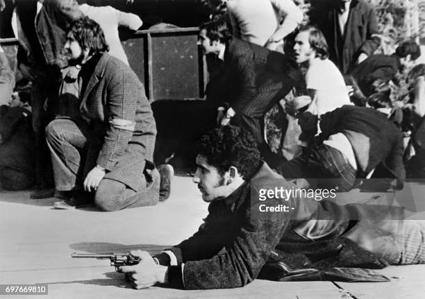 Peronist demonstrators who have come to welcome Juan Domingo Peron, former Argentinian President, upon his return to Argentina after a long exile,...