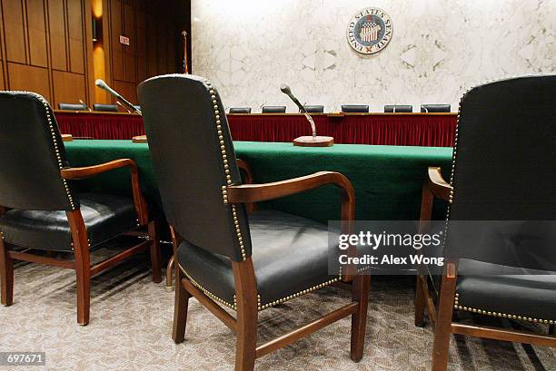 Empty chairs sit in a Senate hearing room set aside for an investigation into the collapse of Enron Corporation February 4, 2002 at the Hart Senate...