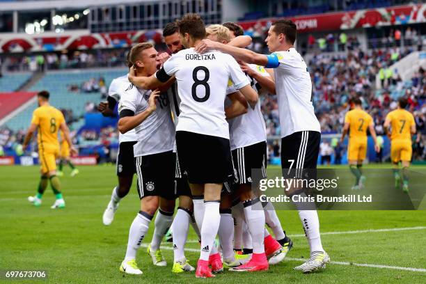 Lars Stindl of Germany is mobbed by his team-mates after scoring the opening goal during the FIFA Confederations Cup Russia 2017 Group B match...