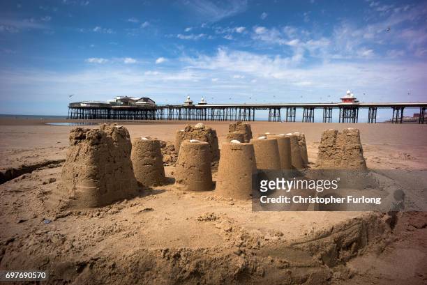 Sandcastle stands in front of Blackpool's North Pier sunshine on June 19, 2017 in Blackpool, England. The UK has officially been put on heatwave...