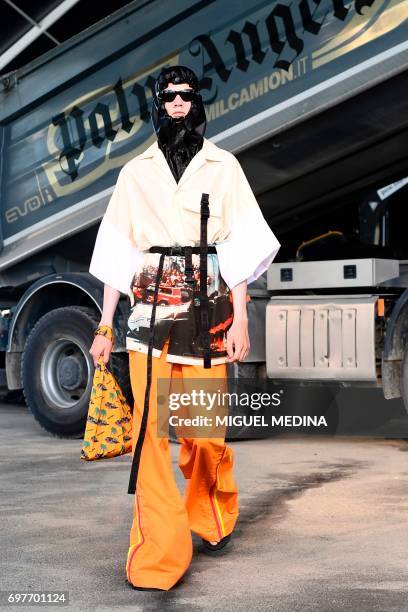 Model presents a creation for fashion house Palm Angels during the Men's Spring/Summer 2018 fashion shows in Milan, on June 19, 2017. / AFP PHOTO /...