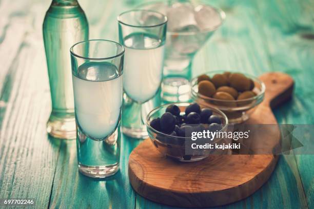 greek ouzo and olives - ouzo stock pictures, royalty-free photos & images