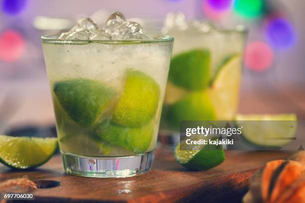 sweet and refreshing drink caipirinha cocktail - caipirinha stock pictures, royalty-free photos & images