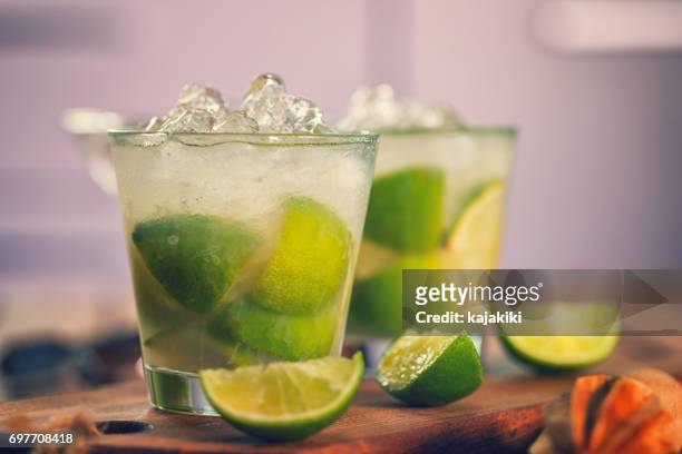 sweet and refreshing drink caipirinha cocktail - caipirinha stock pictures, royalty-free photos & images