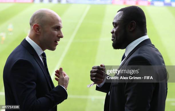 Legends Mark Bresciano and Gerald Asamoa in discussion during the FIFA Confederations Cup Russia 2017 Group B match between Australia and Germany at...