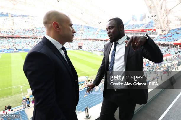Legends Mark Bresciano and Gerald Asamoa in discussion during the FIFA Confederations Cup Russia 2017 Group B match between Australia and Germany at...