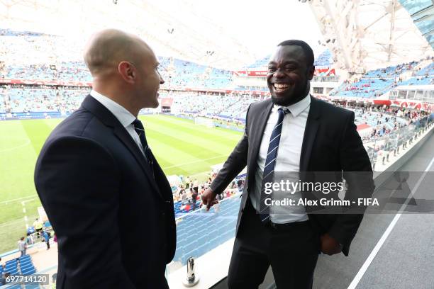 Legends Mark Bresciano and Gerald Asamoa in discussion during the FIFA Confederations Cup Russia 2017 Group B match between Australia and Germany at...