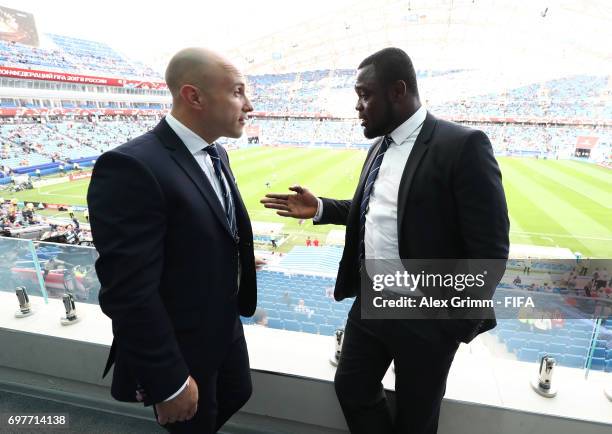 Legends Mark Bresciano and Gerald Asamoa in discussion during the FIFA Confederations Cup Russia 2017 Group B match between Australia and Germany at...