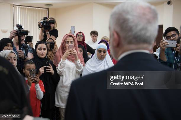 Labour leader Jeremy Corbyn talks to worshippers and local residents at Finsbury Park Mosque on June 19, 2017 in London, England. Worshippers were...