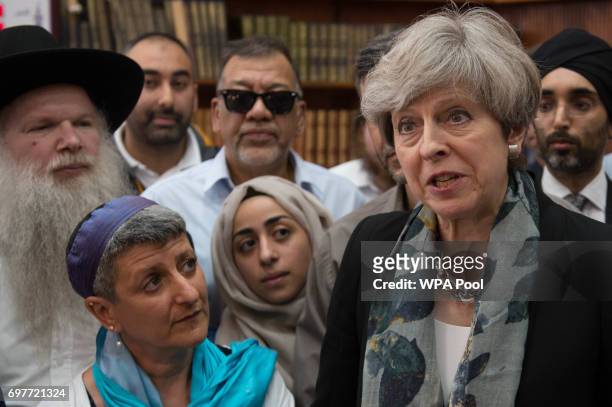 British Prime Minister Theresa May talks to faith leaders at Finsbury Park Mosque on June 19, 2017 in London, England. Worshippers were struck by a...