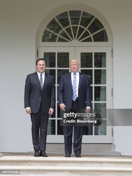 President Donald Trump and Juan Carlos Varela, Panama's president, left, stand for photographs near the Oval Office of the White House in Washington,...