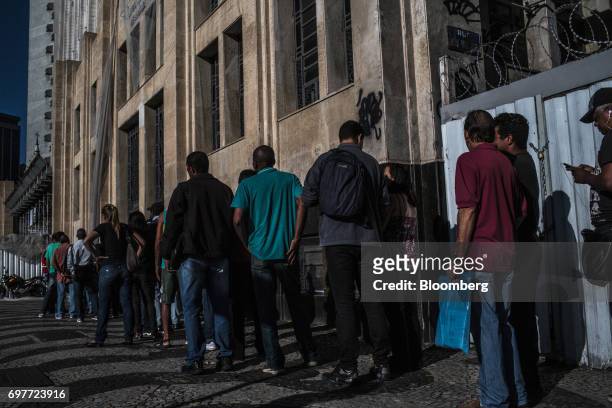 Job seekers stand on line outside the Ministry of Labor and Employment building in Rio de Janeiro, Brazil, on Monday, June 19, 2017. The Brazil Labor...