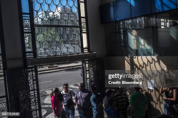 Job seekers stand on line inside the Ministry of Labor and Employment building in Rio de Janeiro, Brazil, on Monday, June 19, 2017. The Brazil Labor...