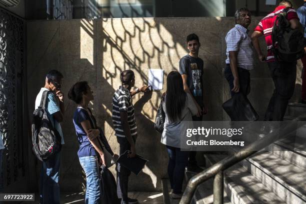 Job seekers stand on line inside the Ministry of Labor and Employment building in Rio de Janeiro, Brazil, on Monday, June 19, 2017. The Brazil Labor...