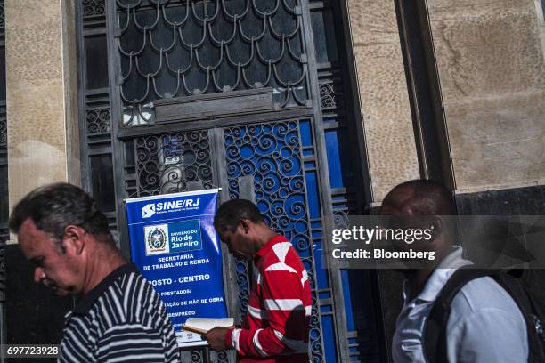 Job seekers stand on line outside the Ministry of Labor and Employment building in Rio de Janeiro, Brazil, on Monday, June 19, 2017. The Brazil Labor...