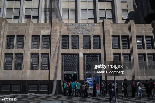 Job seekers stand on line outside the Ministry of Labor and Employment building in Rio de Janeiro, Brazil, on Monday, June 19, 2017. The Brazil Labor...