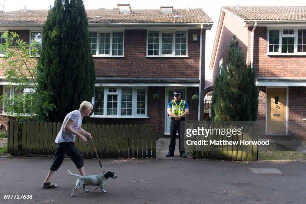 Police officer stands outside a property during a search of a house on Glyn Rhosyn, Pentwyn, which is believed to be the home of Darren Osborne, who...