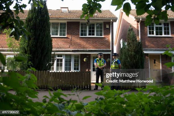 Two PCSO's stand outside a property during a search of a house on Glyn Rhosyn, Pentwyn, which is believed to be the home of Darren Osborne, who has...