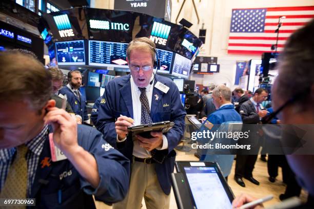 Trader works on the floor of the New York Stock Exchange in New York, U.S., on Monday, June 19, 2016. U.S. Stocks rose, following a lull in markets...