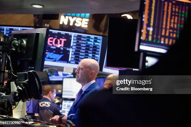 Trader works on the floor of the New York Stock Exchange in New York, U.S., on Monday, June 19, 2016. U.S. Stocks rose, following a lull in markets...