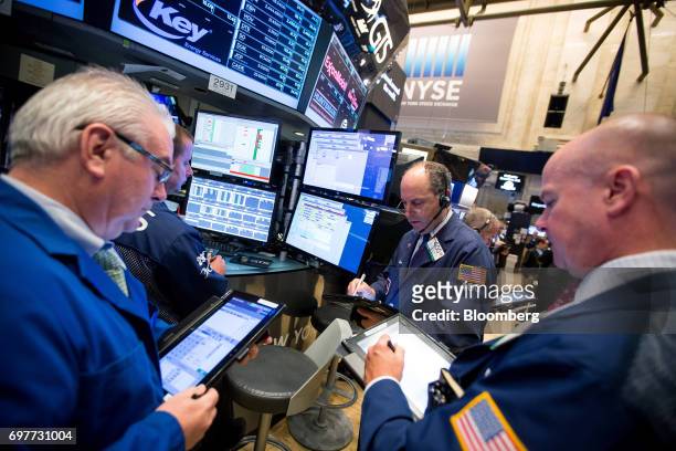 Traders work on the floor of the New York Stock Exchange in New York, U.S., on Monday, June 19, 2016. U.S. Stocks rose, following a lull in markets...