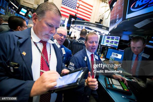 Traders work on the floor of the New York Stock Exchange in New York, U.S., on Monday, June 19, 2016. U.S. Stocks rose, following a lull in markets...