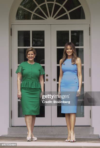 First Lady Melania Trump, right, and Lorena Castillo Garca de Varela, first lady of Panama, stand for photographs near the Oval Office of the White...