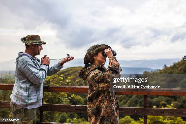 young active couple hiking - binocular vision stock pictures, royalty-free photos & images