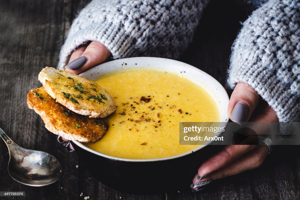 Carrot pumpkin cream soup with garlic bread