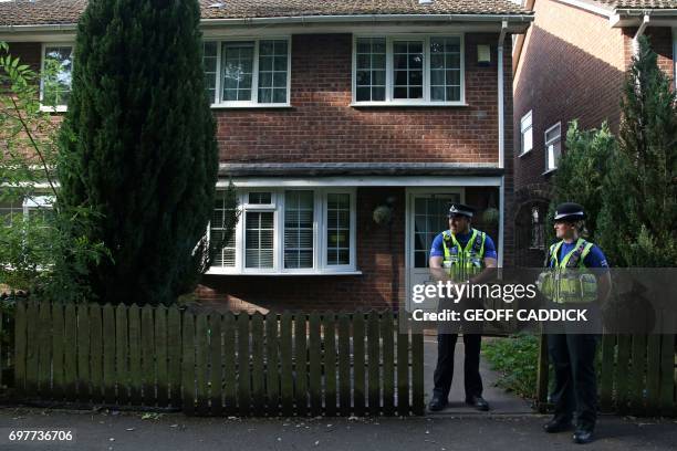 Police officers stand guard outside a residential property in Cardiff, south Wales as investigations continue into a van attack in Finsbury Park,...