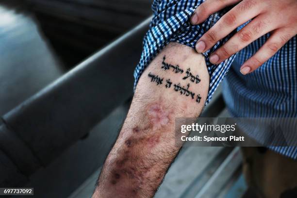 Michael, a patient at a Brooklyn methadone clinic for those addicted to heroin, displays a Hebrew tatoo of the "shema" prayer in Judaism that he...