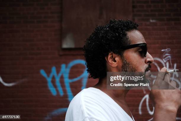 Carlos, a patient at a Brooklyn methadone clinic for those addicted to heroin, pauses on June 19, 2017 in New York City. He and his girlfriend...