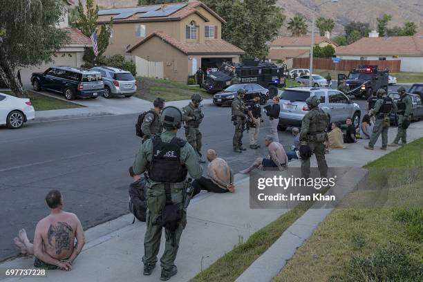 Federal agents detained many people after serving arrest and search warrants at home being operated as a rehab center, early Friday morning June 16,...