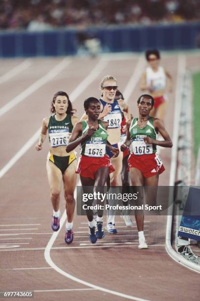 Ethiopian gold and silver medal winning athletes Derartu Tulu and Gete Wami lead bronze medal winning Fernanda Ribeiro of Portugal and fourth placed...