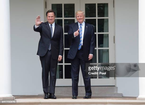 President Donald Trump and Panama's President Juan Carlos Varela greet the press outside the Oval Office at the White House on June 19, 2017 in...