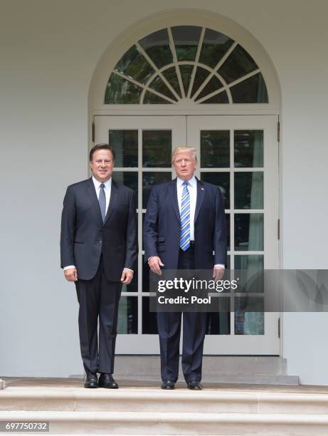 President Donald Trump and Panama's President Juan Carlos Varela greet the press outside the Oval Office at the White House on June 19, 2017 in...