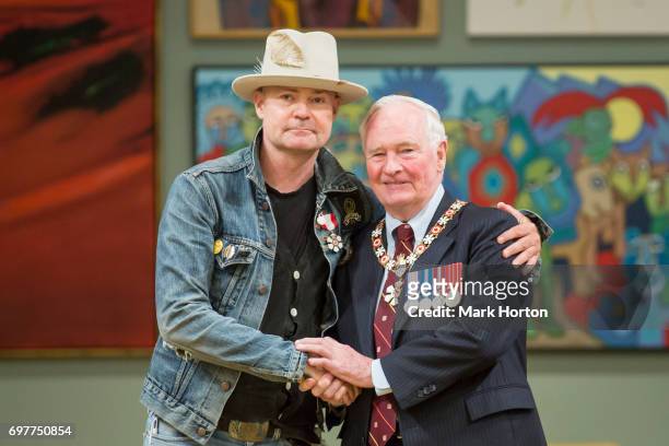 Canadian singer Gord Downie is invested as a Member of the Order of Canada by Governor General of Canada David Johnston at Rideau Hall on June 19,...